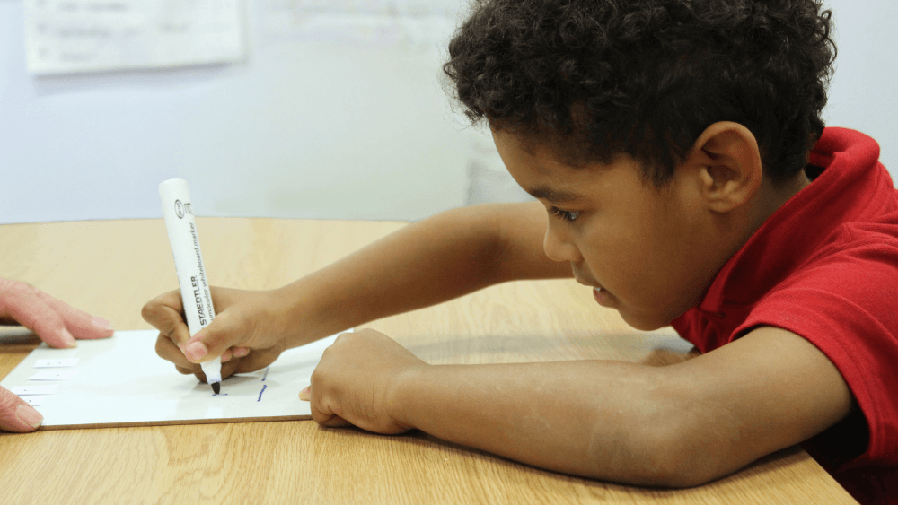 Boy engaged in phonics lesson